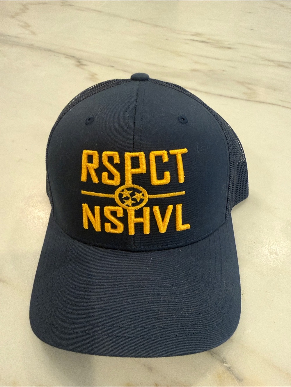 Nashville Predators Navy Trucker Hat w/Gold 'RSPCT NSHVL' Embroidery